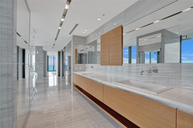 19575 Collins Ave Unit 33, Sunny Isles Beach, FL 33160 - bathroom featuring double vanity, a shower stall, and tile patterned floors