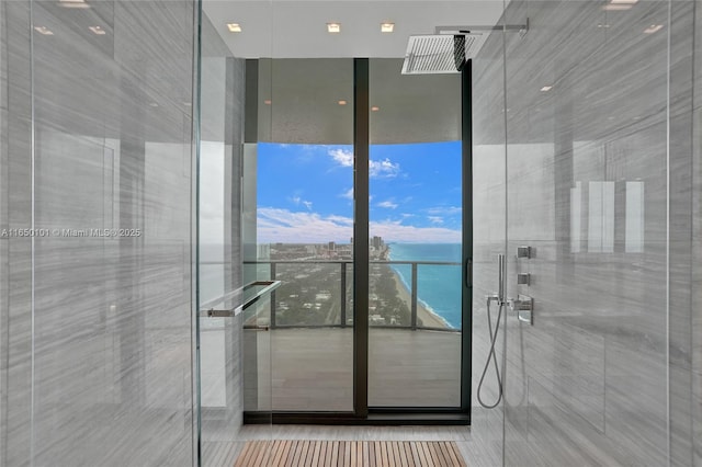 19575 Collins Ave Unit 33, Sunny Isles Beach, FL 33160 - full bathroom with a shower stall, a water view, and floor to ceiling windows