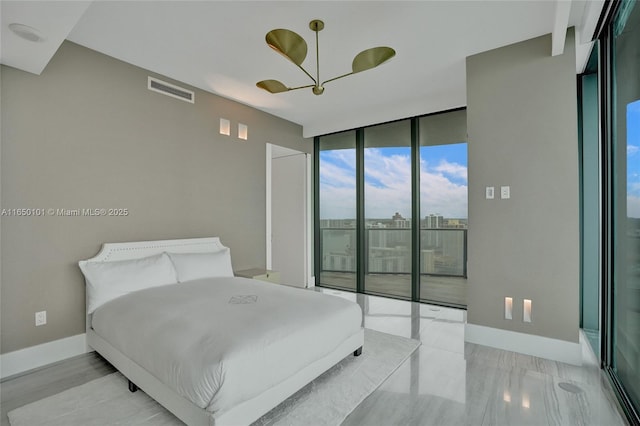 19575 Collins Ave Unit 33, Sunny Isles Beach, FL 33160 - bedroom with access to outside, floor to ceiling windows, and baseboards