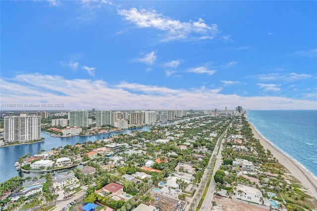 birds eye view of property with a view of the beach and a water view