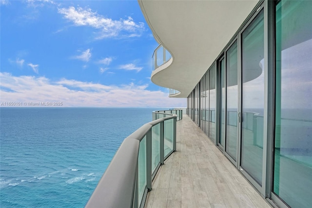 balcony featuring a water view