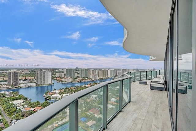 balcony featuring a water view