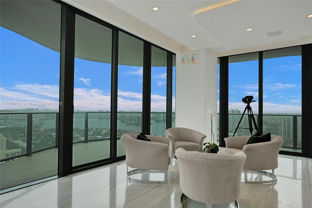 19575 Collins Ave Unit 33, Sunny Isles Beach, FL 33160 - dining space with expansive windows, a water view, and recessed lighting