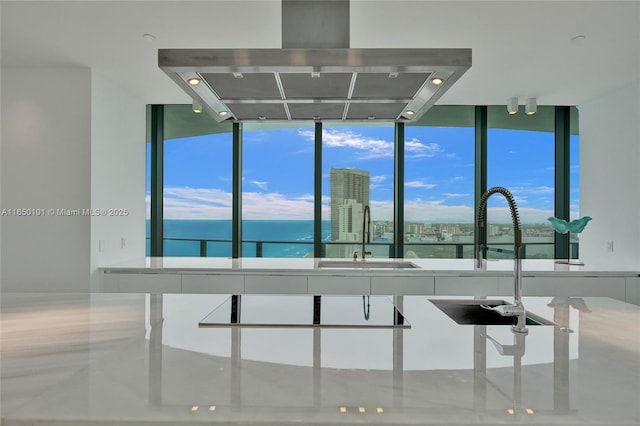 19575 Collins Ave Unit 33, Sunny Isles Beach, FL 33160 - kitchen featuring range hood, a sink, a water view, and expansive windows