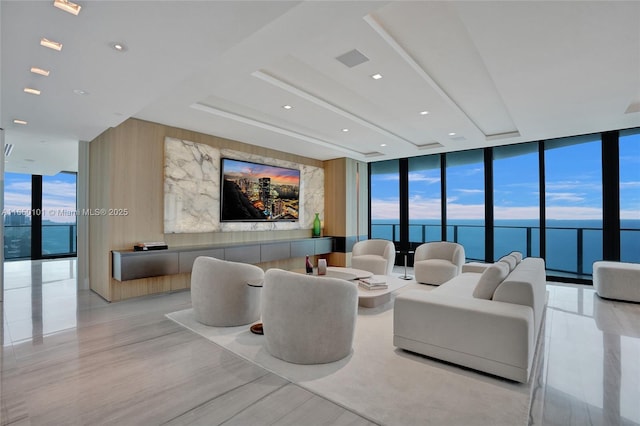 living room with plenty of natural light and a wall of windows