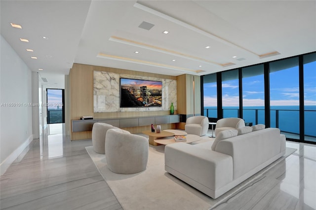 living room with floor to ceiling windows and plenty of natural light