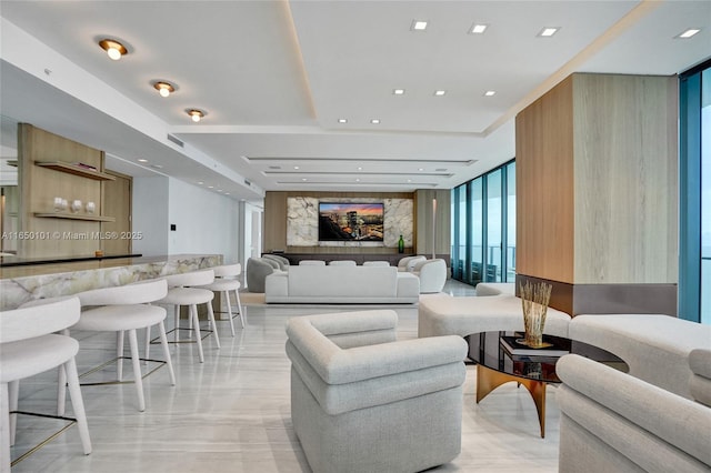 living room featuring floor to ceiling windows