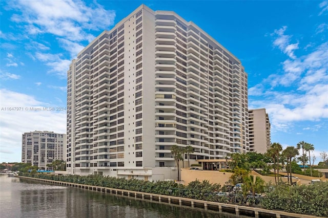 view of building exterior with a water view