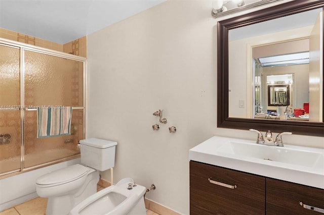 full bathroom featuring toilet, tile patterned flooring, shower / bath combination with glass door, a bidet, and vanity