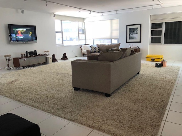 living room featuring tile patterned floors and rail lighting