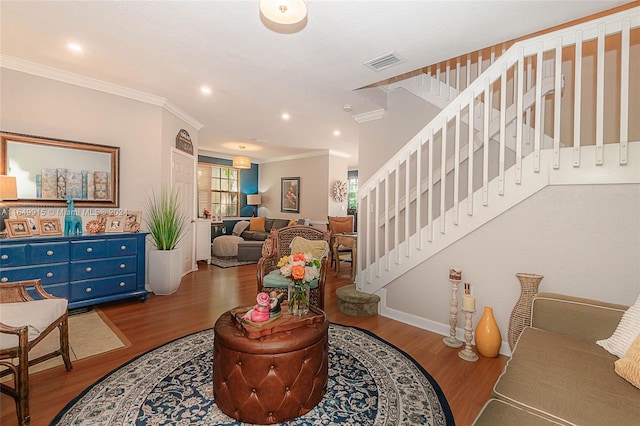 entrance foyer with crown molding and wood-type flooring