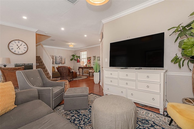 living room featuring crown molding and hardwood / wood-style flooring