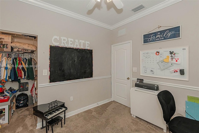 carpeted office featuring crown molding and ceiling fan