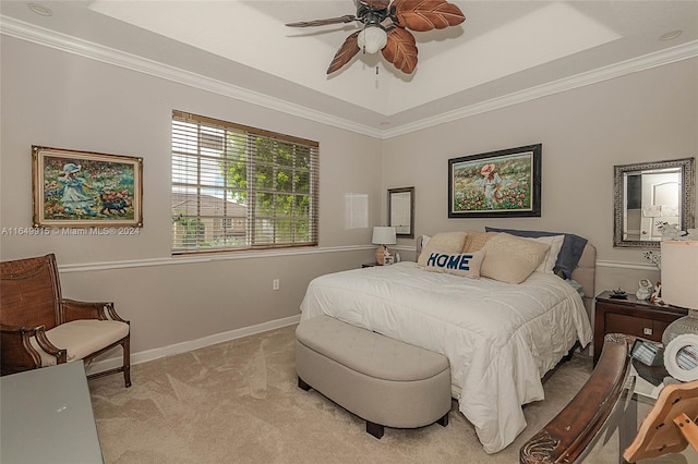 bedroom with ornamental molding, light colored carpet, and ceiling fan