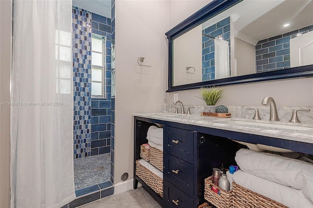 bathroom featuring curtained shower, tile patterned flooring, and vanity