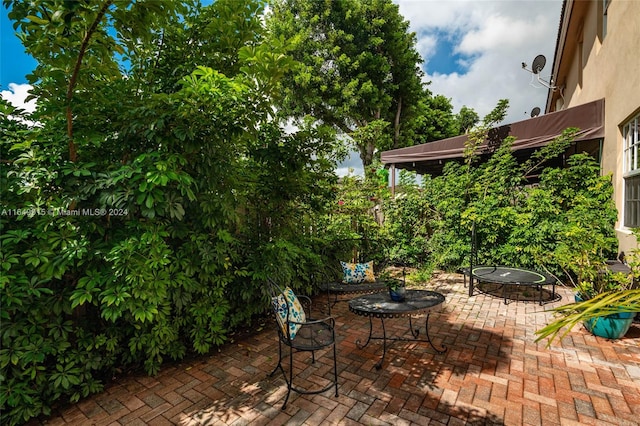 view of patio with a fire pit