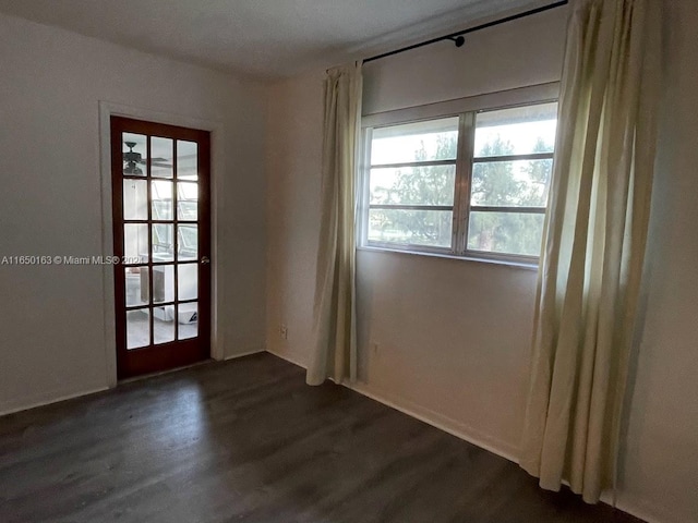 empty room featuring dark hardwood / wood-style flooring