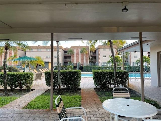 view of patio with a community pool