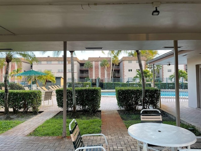 2510 SW 81st Ave Unit 405, Davie, FL 33324 - view of patio with fence, a community pool, and a residential view