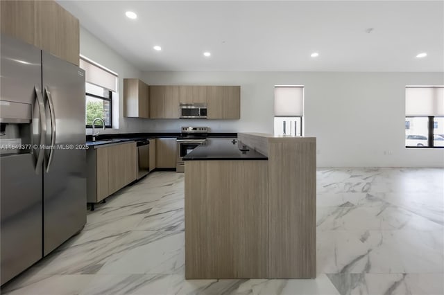 6159 SW 36th Ct, Miramar, FL 33023 - kitchen with appliances with stainless steel finishes, light marble finish flooring, dark countertops, a sink, and modern cabinets