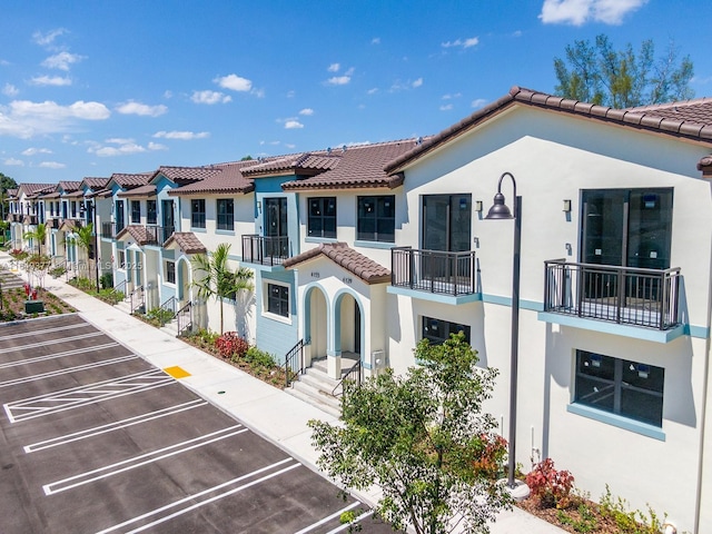 6159 SW 36th Ct, Miramar, FL 33023 - view of building exterior featuring a residential view and uncovered parking