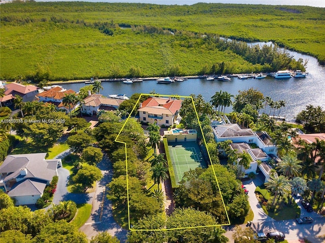 drone / aerial view featuring a residential view and a water view