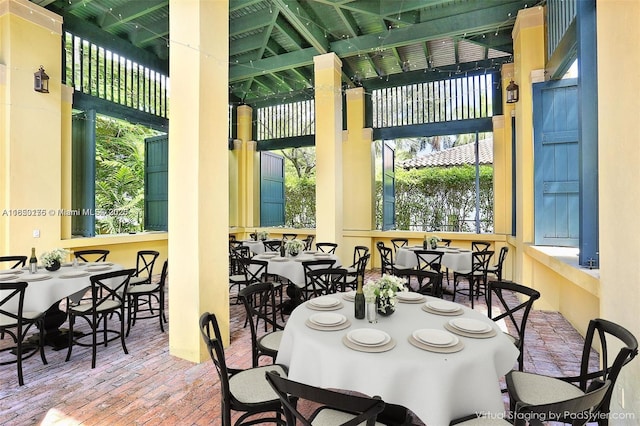 dining room with brick floor