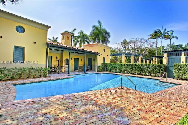 pool featuring a patio area