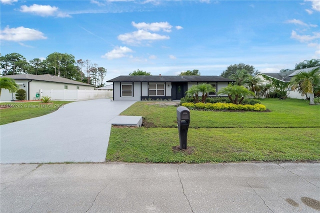 ranch-style home with a front lawn