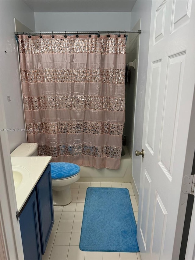 full bathroom with vanity, tile patterned floors, toilet, and shower / bath combo