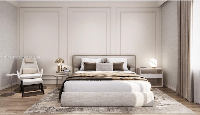 bedroom featuring baseboards and light wood-style floors