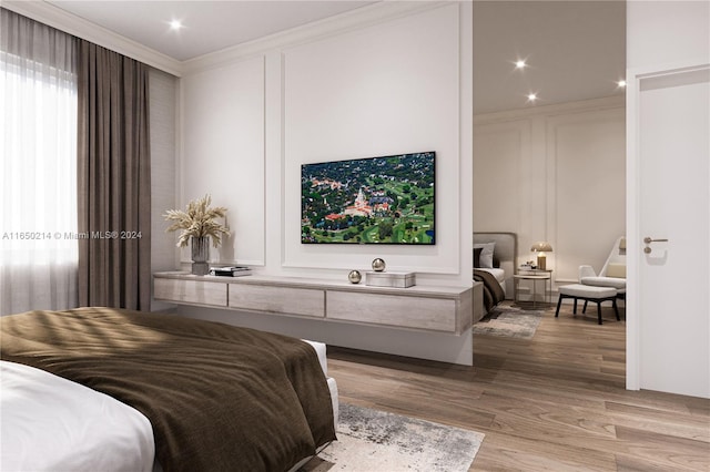 bedroom featuring ornamental molding, a decorative wall, recessed lighting, and wood finished floors