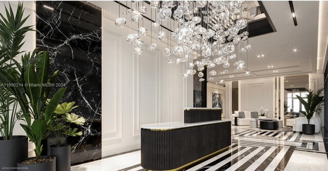 reception area featuring an inviting chandelier