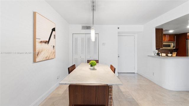 770 Claughton Island Dr Unit 711, Miami, FL 33131 - dining room featuring baseboards and light tile patterned floors