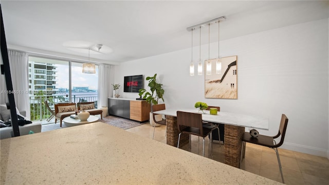 770 Claughton Island Dr Unit 711, Miami, FL 33131 - dining space with light tile patterned flooring and baseboards