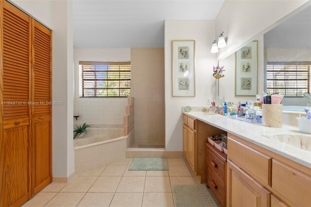 dining area with light tile patterned floors, ceiling fan, and a wall of windows