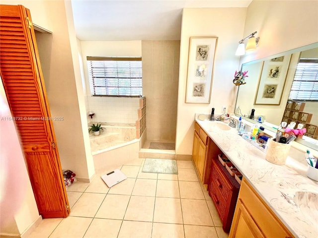 bathroom with vanity, tile patterned flooring, and separate shower and tub