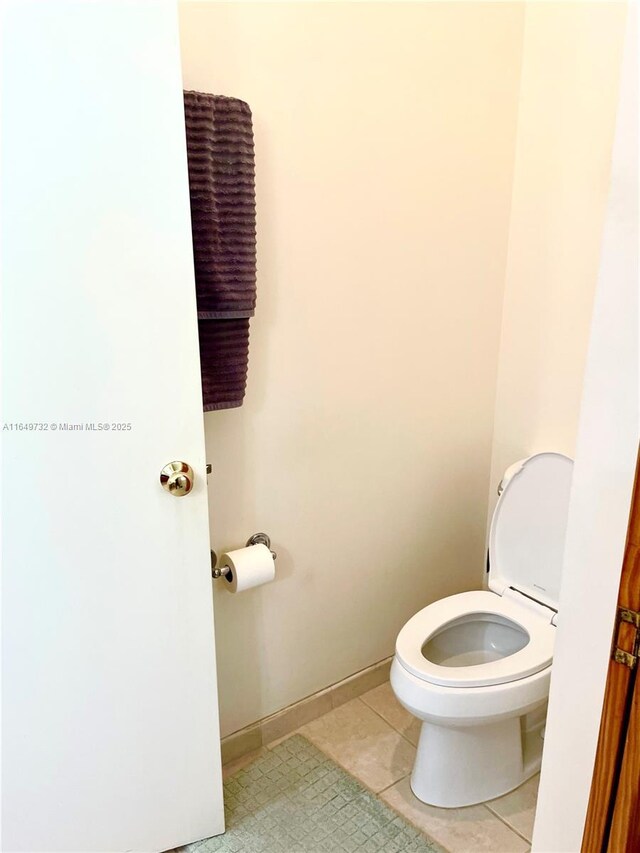 bathroom with tile patterned floors and toilet