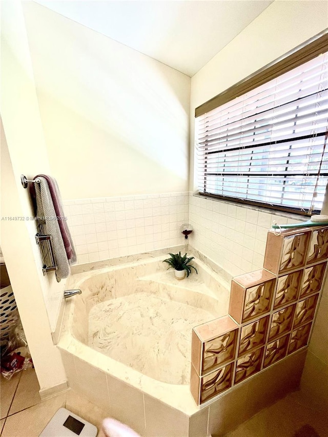 bathroom featuring a relaxing tiled tub