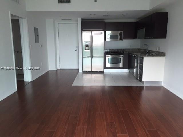 kitchen featuring light hardwood / wood-style flooring, stainless steel appliances, and sink