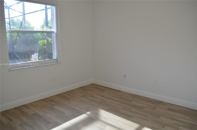 empty room with light hardwood / wood-style floors