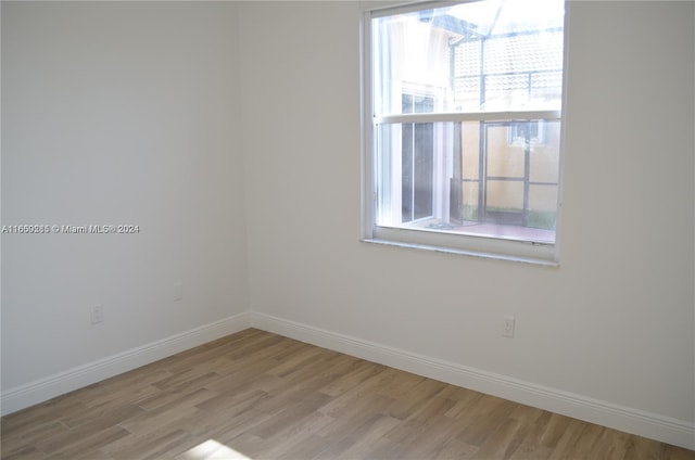 spare room with light hardwood / wood-style floors