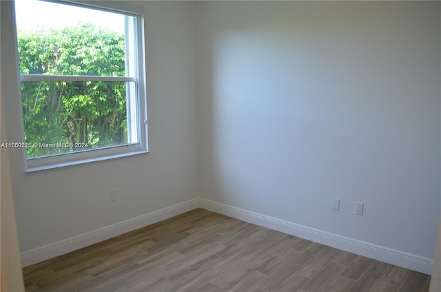 empty room with hardwood / wood-style floors