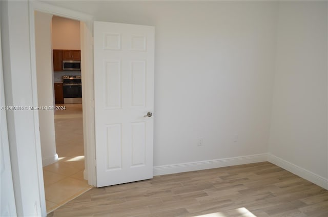 empty room with light wood-type flooring