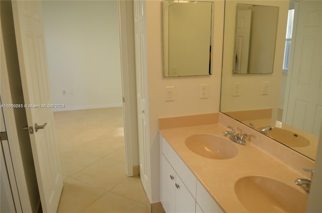 bathroom with tile patterned flooring and vanity