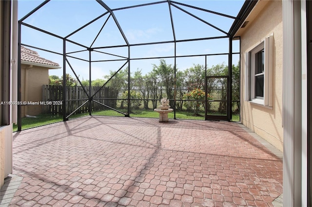 view of patio / terrace featuring a lanai