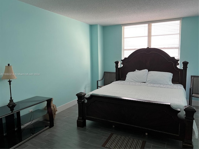 bedroom featuring a textured ceiling