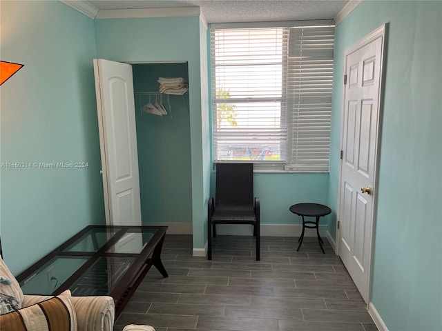 living area featuring ornamental molding