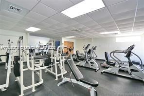 gym featuring a paneled ceiling