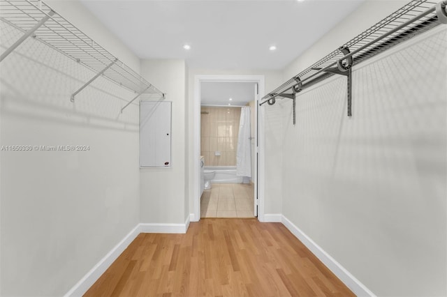 spacious closet with light hardwood / wood-style floors